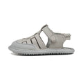 sandalias trenzadas suela blandita plana bebe color gris calpe feroz ss24